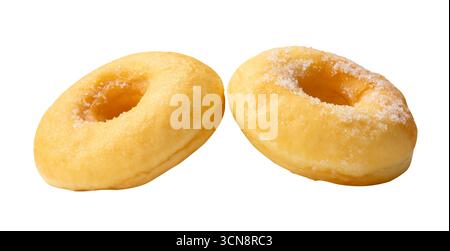 Side view of two brown sugar glazed cinnamon donuts in set is isolated on white background with clipping path. Stock Photo