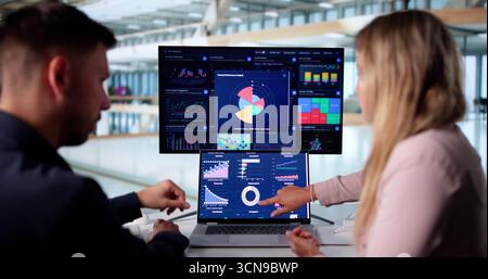 Business Professionals Utilizing Data Analytics To Analyze Market Trends. Stock Photo