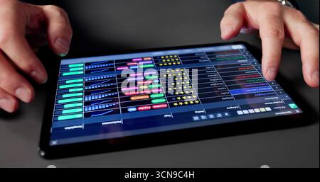 Older Caucasian Man Working On Medical Data Spreadsheet In Office Stock Photo