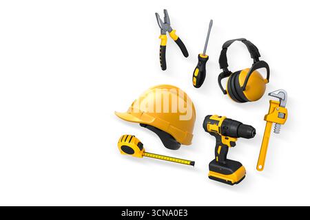 Various construction tools including wrench, hammer, pliers, and helmet isolated on white background with clipping path, concept of building work Stock Photo