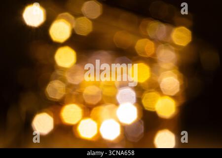 Gold bokeh lights background. Golden bokeh wallpaper. Stock Photo