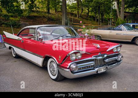 Karlskrona, Sweden ; September 13, 2025: Side view of 1958 Dodge Custom Royal in two tone paint with chrome details during classic car show at Wamopar Stock Photo