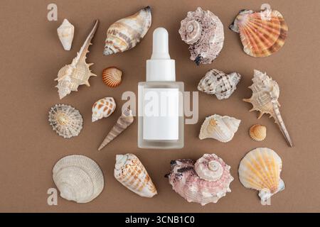 Spilled red wine with glass and cork on white background. Minimal and dramatic composition symbolizing fragility, accident and lifestyle moments. Stock Photo