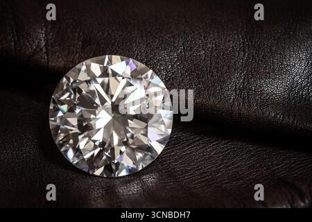 Big Carat Diamond Gemstone on Brown Leather Stock Photo