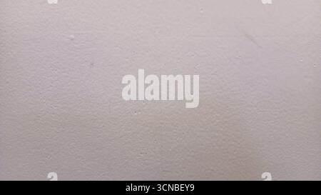 Textured white wall background with subtle imperfections Stock Photo