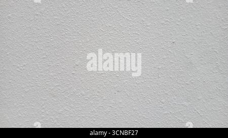 Textured white wall background with subtle grunge and copy space Stock Photo