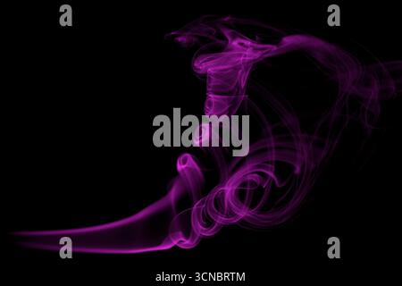 Purple/pink smoke photography with a black background. Stock Photo