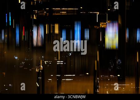 Abstract Composition of Blurred Lights and Reflections at Night. Stock Photo