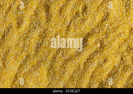 Abstract Yellow Cooking Corn Grits Background Stock Photo