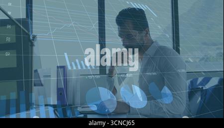 Reviewing data middle eastern professional analyzing charts at modern office with laptop and binder Stock Photo