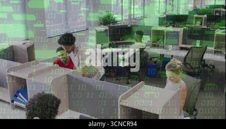 Leaning man in white shirt assisting red-shirt coworker at office cubicle, with binary overlay Stock Photo