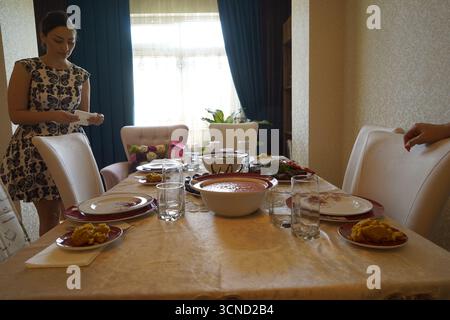 Woman Preparing Table Dinner Concept,toned Stock Photo