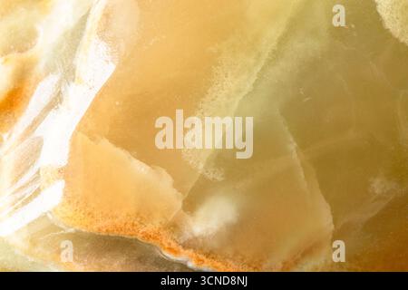 gemological background - polished surface of calcite onyx rock close up Stock Photo