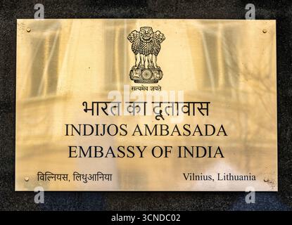 Plaque of the Embassy of India in Vilnius, Lithuania. The golden signboard displays the Indian national emblem and inscriptions in Hindi Stock Photo