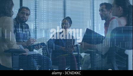 Collaborating colleagues exchanging insights in modern conference room, overlaying digital charts Stock Photo