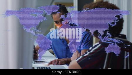 Collaborating two men working on laptops at office meeting table with mask and map overlay Stock Photo