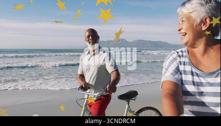 Smiling older man and laughing woman riding bicycles along beach shoreline, with star overlays Stock Photo