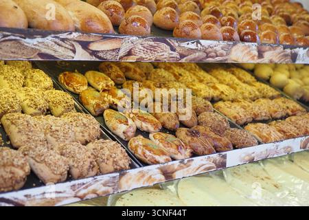 Freshly baked goods display at local bakery Stock Photo