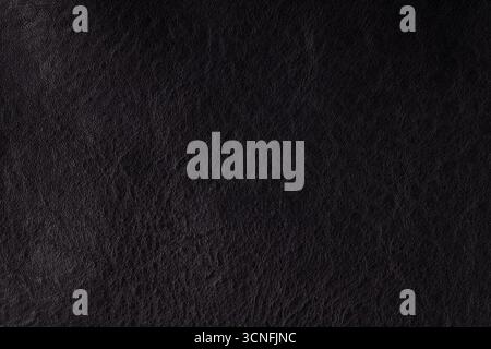 Macro photo of black leather surface with detailed texture and natural grain Stock Photo