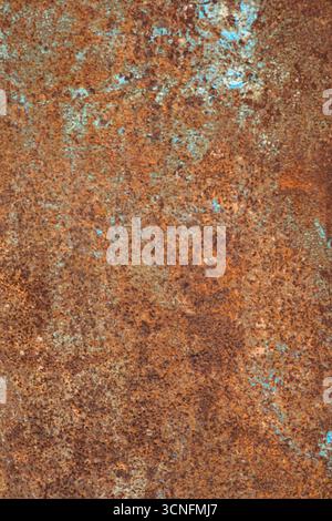 Close-up of rusty metal surface with brown and blue patches. Natural texture of aged metal. Stock Photo