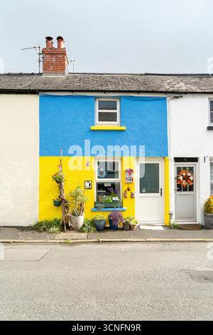 Small terraced house painted in Ukrainian flag colours and decorated with ornaments Stock Photo