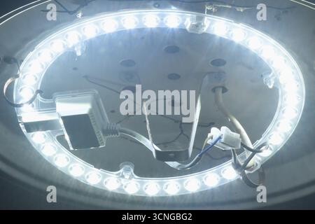 LED electric lamp hanging on ceiling room in the night Stock Photo