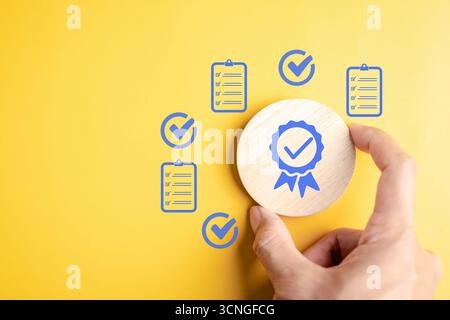 Compliance verification and quality assurance concept with approval certificate, checklist symbols Stock Photo
