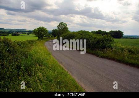 Bucolic summer landscape of a country lane through farmland in eastern Bedfordshire, England, UK Stock Photo