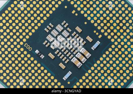 Central processing unit with gold contacts and electronic components. Top view Stock Photo