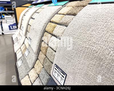 Retail carpet swatches in curved display Stock Photo