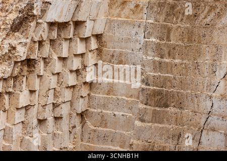 Abstract view of a stepped white stone quarry with geometric layers, sunlight casting soft shadows, minimalistic and bright compositio Stock Photo