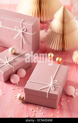 Wonderful Christmas gift box surrounded by Christmas ornaments. Concept of the winter and Christmas holiday. Stock Photo