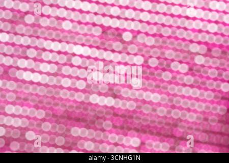 Abstract bokeh background. Pink and white circles on a pink background Stock Photo