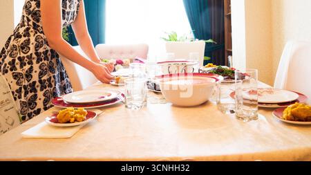 Woman Preparing Table Dinner Concept,toned Stock Photo