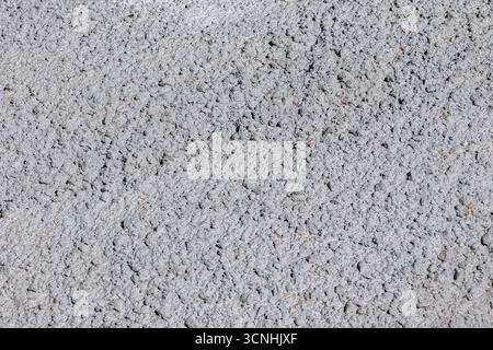 Concrete wall showing rough gray surface. Industrial material offering a detailed abstract texture for construction and design concepts Stock Photo