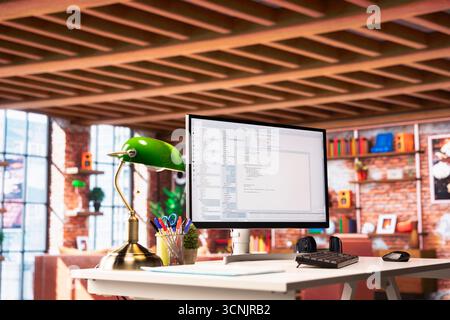 UI on PC screen in home office with programming code being executed. Coding application on computer display used by IT programmer to write and test code in modern apartment Stock Photo