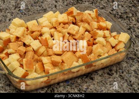 Unbaked Diced Bread Pudding in Baking Dish Ready to Cook Stock Photo