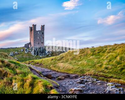 Dunstanburgh Castle, Northumberland, UK - Early morning in spring. Stock Photo