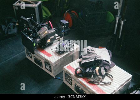 Arri Alexa Mini camera with wireless focus system resting on a case surrounded by lenses. Professional film equipment setup. Stock Photo