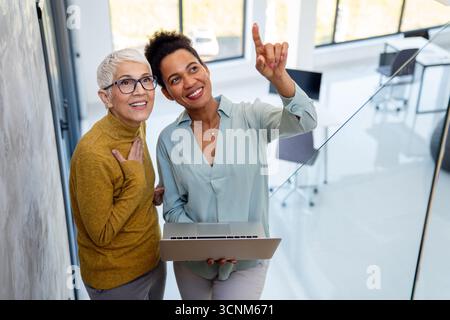 Business people with laptop, innovation in research and programming for future app technology Stock Photo