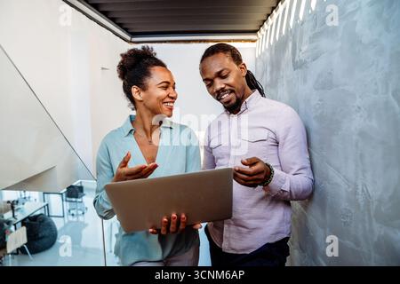 Programmers cooperating at IT company developing apps. People business work office concept Stock Photo