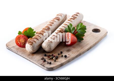 Grilled Bratwurst sausages with cherry tomatoes and parsley isolated on white background Stock Photo