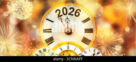 2026 New Year with clock counting down to midnight with golden background and fireworks Stock Photo