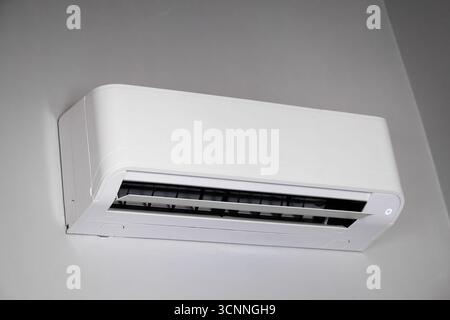 Modern split system air conditioner cooling apartment during summer heat, providing comfort and relief from high temperatures Stock Photo