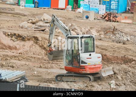 excavator on the construction site. Construction of a new house Stock Photo