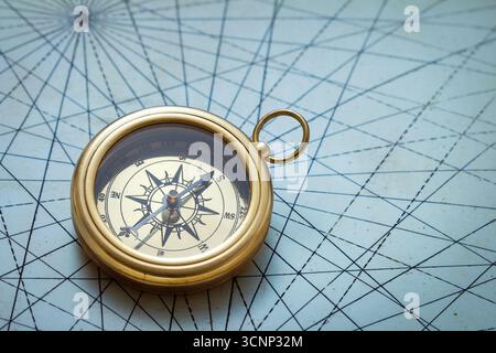 Old compass on vintage map Stock Photo