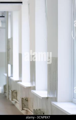 Empty hallway interior with big windows, copy space. Real estate or office rental concept, empty interior. Stock Photo