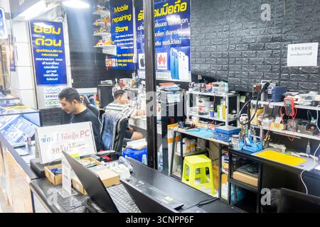 Interior of a mobile phone and computer repair shop in Bangkok, Thailand Stock Photo