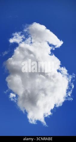 Single fluffy white cloud in blue sky Stock Photo