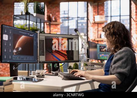 Young woman uses an AI powered assistant for game development, futuristic gaming software. Program processes commands and generates spatial designs using machine learning techniques. Stock Photo